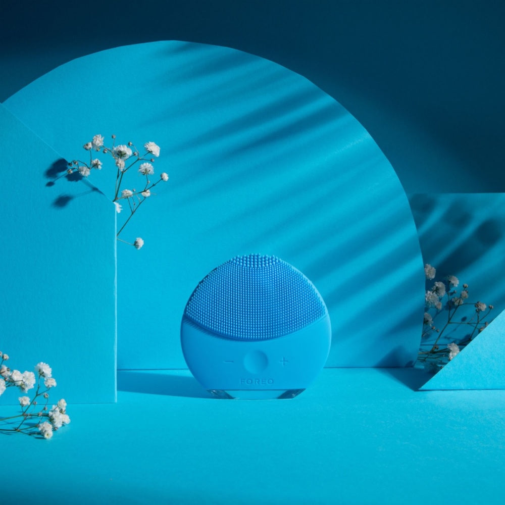 FOREO LUNA Mini 2 Aquamarine facial cleansing brush, compact silicone device for gentle deep skin cleansing.