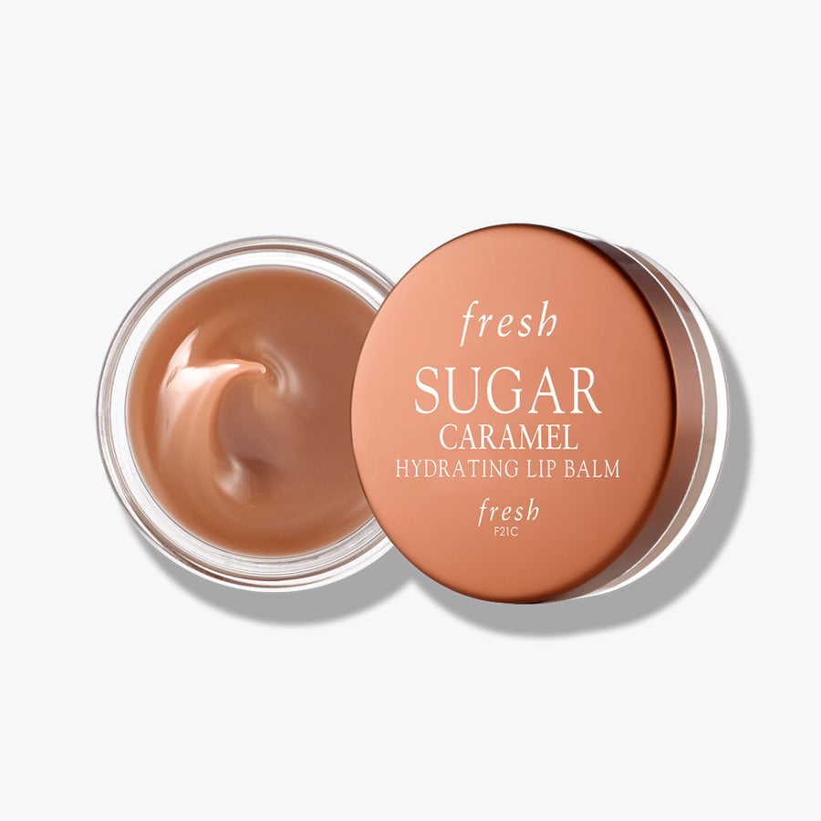 Fresh Sugar Hydrating Lip Balm in Caramel flavor, housed in a round jar for smooth, nourished lips