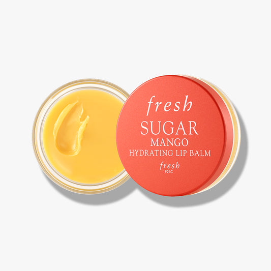 Fresh Sugar Hydrating Lip Balm in Mango flavor with nourishing formula in a round jar