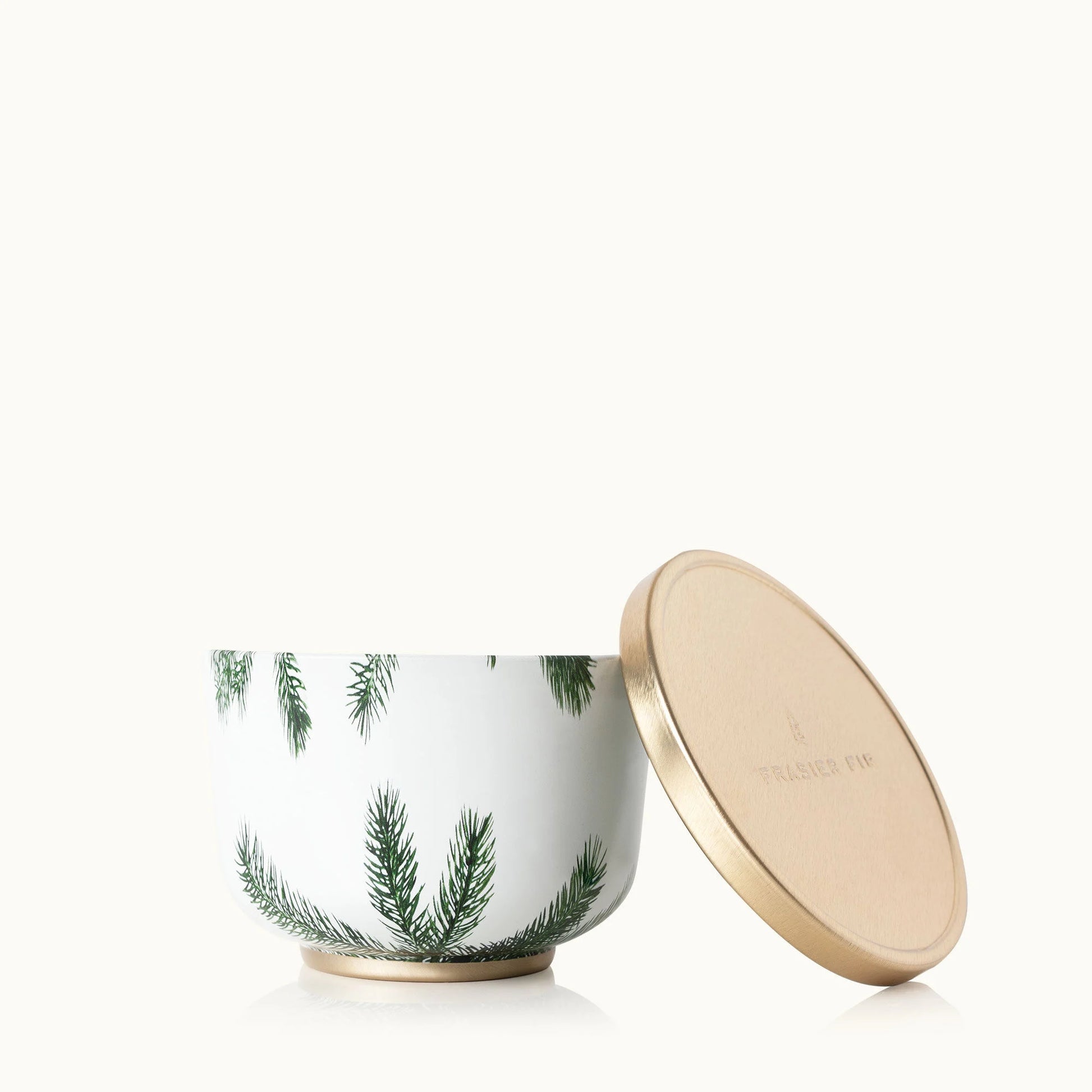 Thymes Frasier Fir Candle Tin with Gold Lid – festive pine-scented candle.







