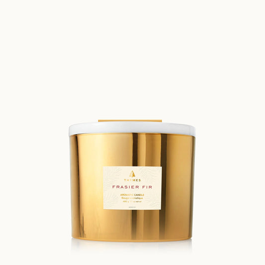 Thymes Frasier Fir Gold 3-Wick Candle 17 oz in elegant glass jar with warm festive scent